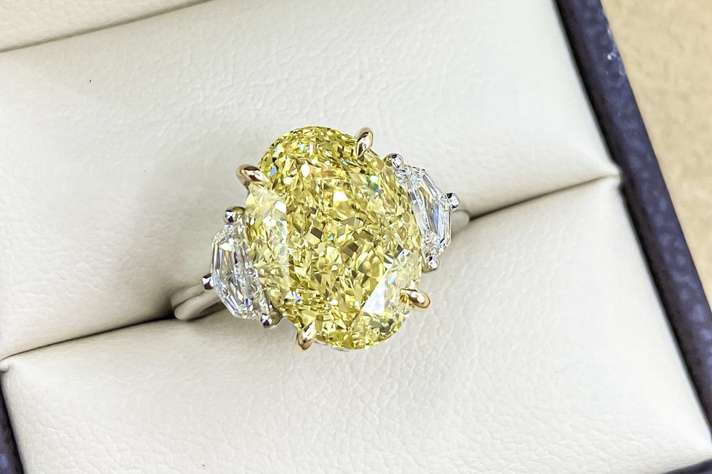 GIA Certified 7.00 Carat Oval Fancy Intense Yellow Diamond Ring