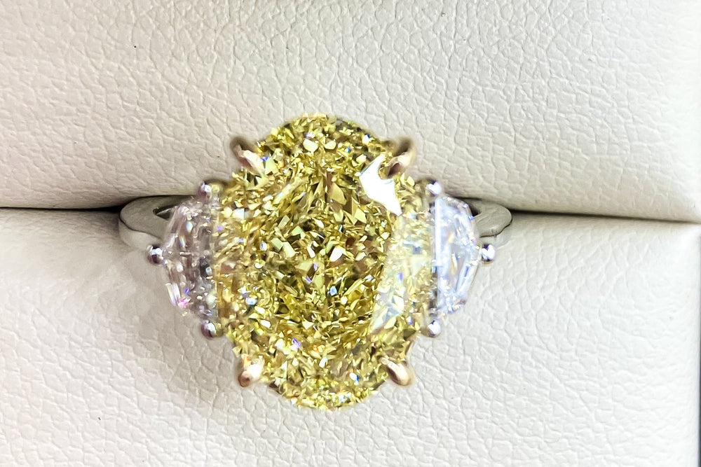 GIA Certified 7.00 Carat Oval Fancy Intense Yellow Diamond Ring